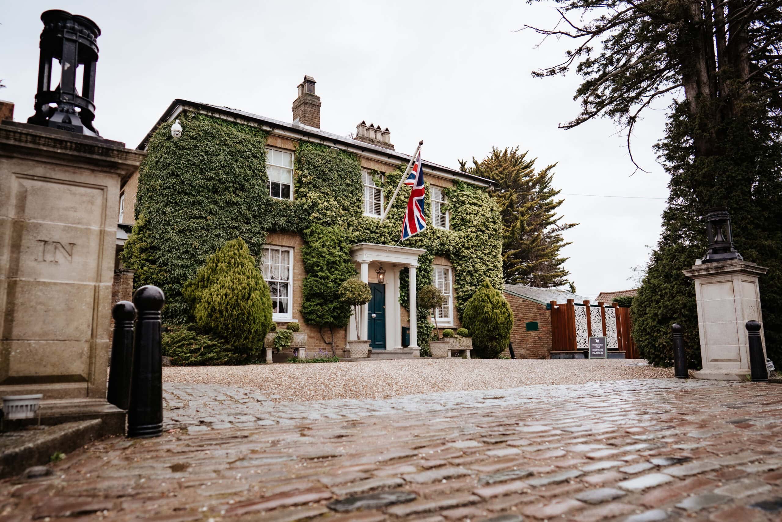 The ivy-covered Georgian facade of Friern Manor country hotel in Dunton, Brentwood, Essex – wedding venue photography by Lily & White