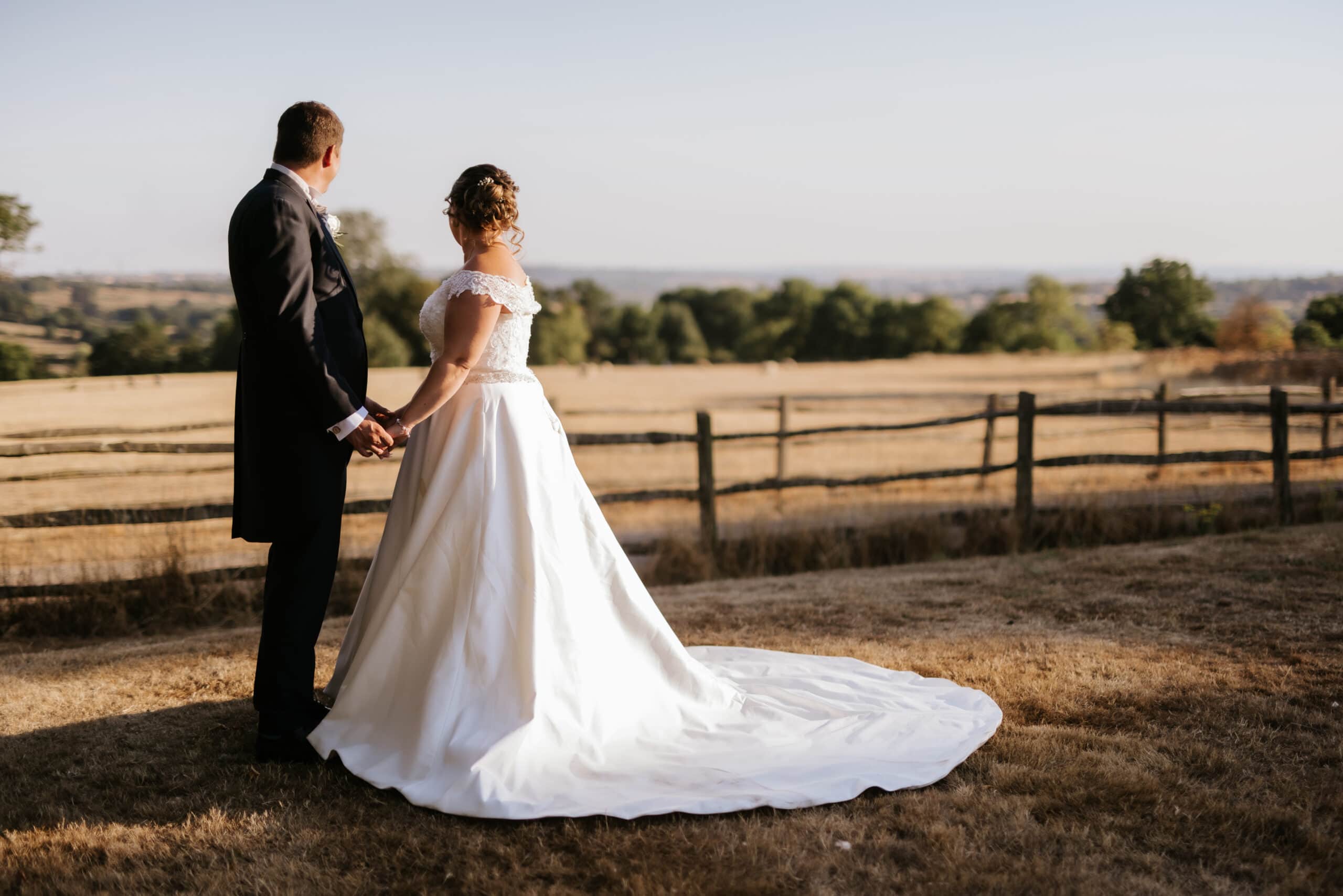 couple walking through Gaynes Park wedding venue in Essex.