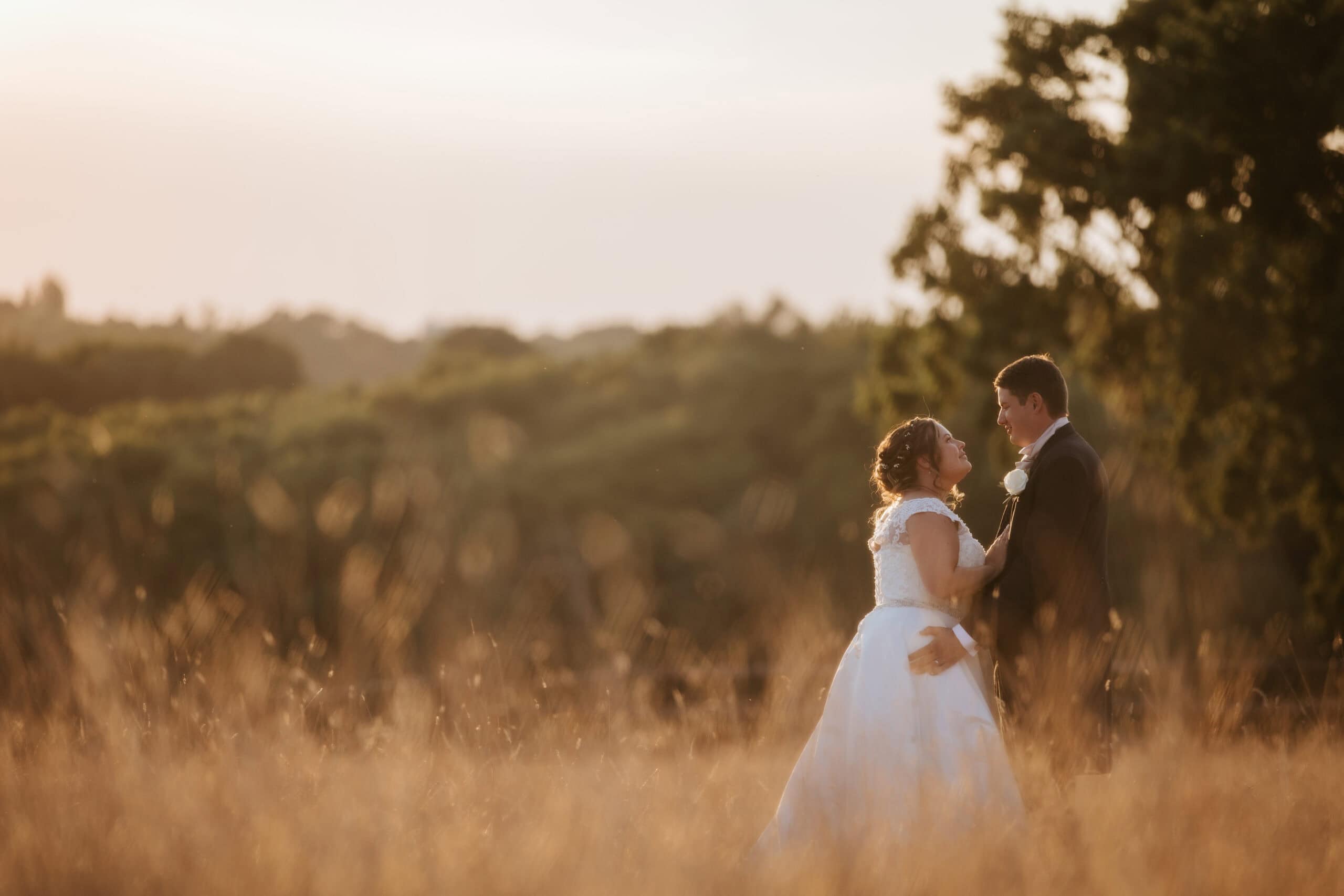 Ella and Rob during their couple portrait session in the grounds at Gaynes Park, summer afternoon light – photographed by Tel, Lily & White