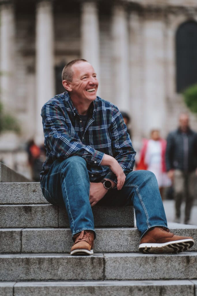 Essex wedding photographer Tel portrait on London street showing editorial photography style and personality