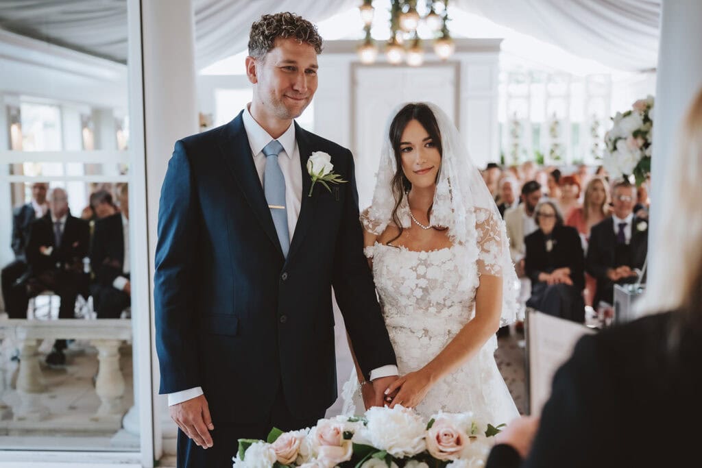 Bride and groom ceremony at Friern Manor country hotel with guests – documentary photography by Lily & White