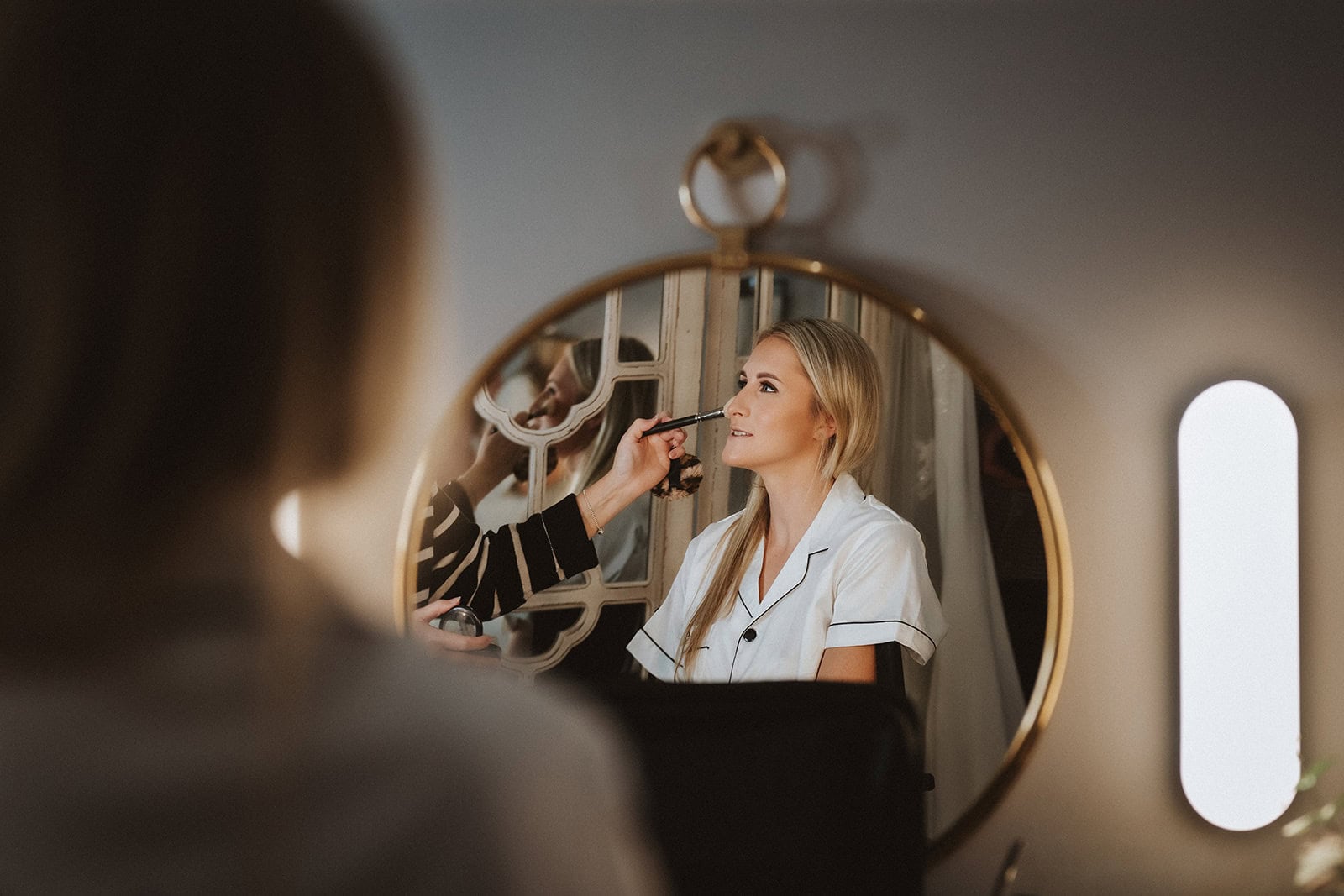 Emily getting ready with her bridal party in the Apple Loft Cottage at Gaynes Park, Essex – bridal preparations photographed by Tel, Lily & White