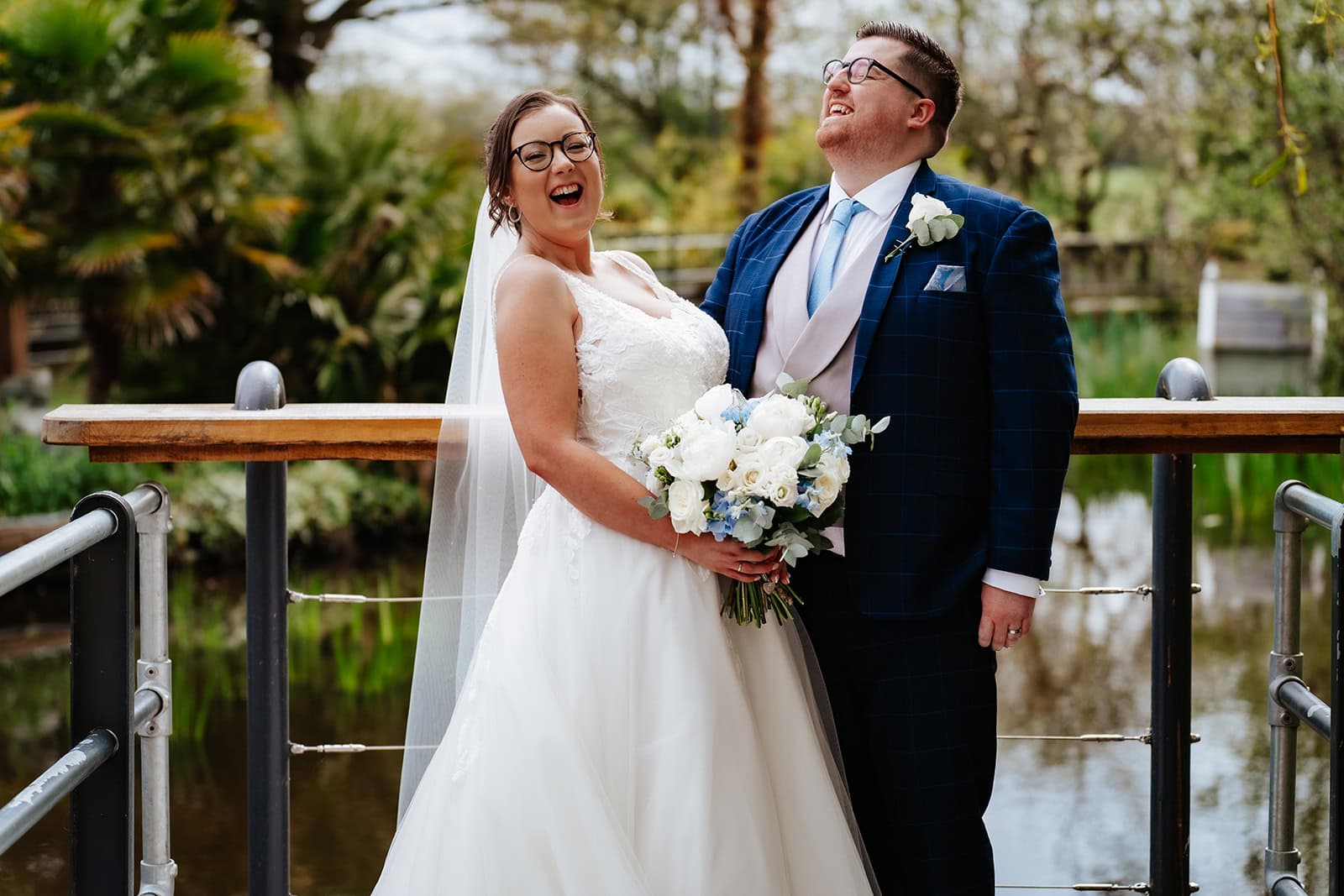 Hollie and Lewis in the gardens at Friern Manor, Brentwood, Essex, on their spring wedding day – 21st April 2023, photographed by Tel, Lily & White